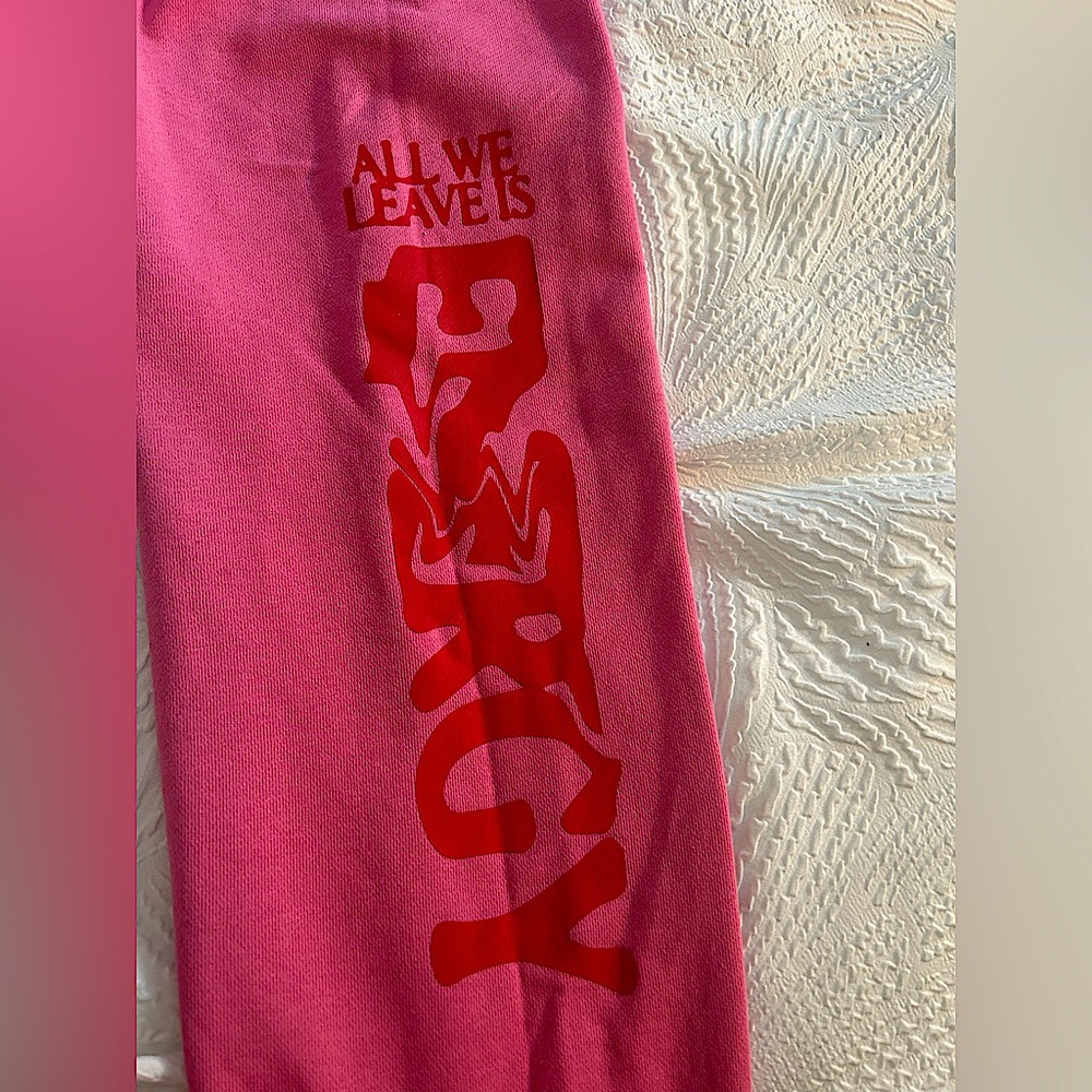 S/M Pink sweatpants with dark print letters. Perfect condition. Selling for $20